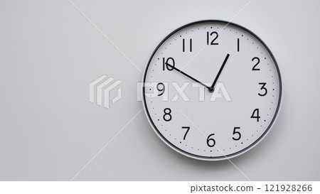 Minimalist Analog Wall Clock with White Face and Simple Black Hands Showing 12.50/00.50 - Ideal for Time Management and Modern Decor Concepts Minimalist Analog Wall Clock with White Face and Simple Black Hands Showing 12.50/00.50 - Ideal for Time Management and Modern Decor Concepts 121928266