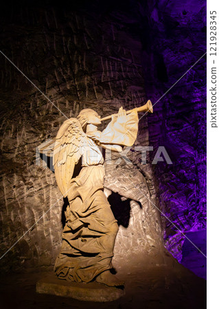 Stone statue of an angel blowing a trumpet. Salt Cathedral of Zipaquira, Colombia. Stone statue of an angel blowing a trumpet. Salt Cathedral of Zipaquira, Colombia. 121928345
