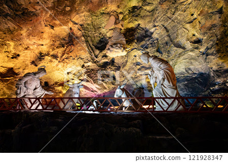 Nativity scene against the illuminated rock wall of the Salt Cathedral of Zipaquira, Colombia. Nativity scene against the illuminated rock wall of the Salt Cathedral of Zipaquira, Colombia. 121928347
