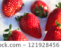 Strawberries lined up on snow 121928456
