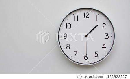 Minimalist Analog Wall Clock with White Face and Simple Black Hands Showing 13.30/01.30 - Ideal for Time Management and Modern Decor Concepts 121928527
