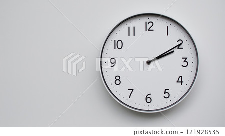 Minimalist Analog Wall Clock with White Face and Simple Black Hands Showing 14.10/02.10 - Ideal for Time Management and Modern Decor Concepts 121928535