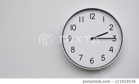 Minimalist Analog Wall Clock with White Face and Simple Black Hands Showing 14.15/02.15 - Ideal for Time Management and Modern Decor Concepts 121928536