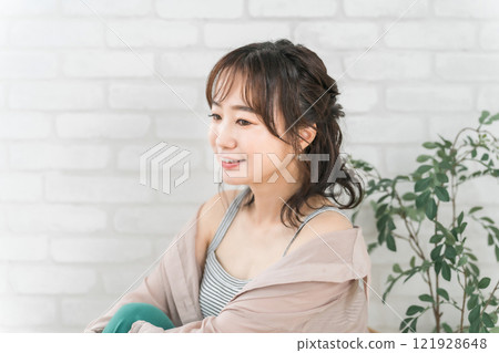 Smiling Japanese woman with her hair done 121928648