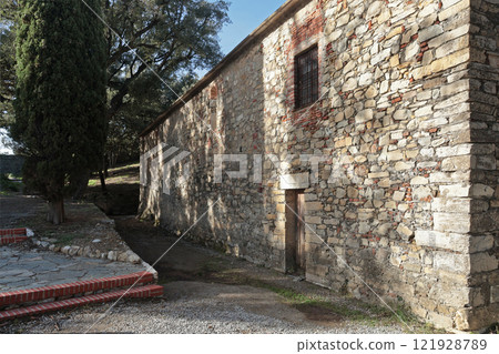 Stone medieval building on mountain on sunny day. Liguria and traditional old building. Sestri Levante, town by sea. Stone medieval building on mountain on sunny day. Liguria and traditional old building. Sestri Levante, town by sea. 121928789