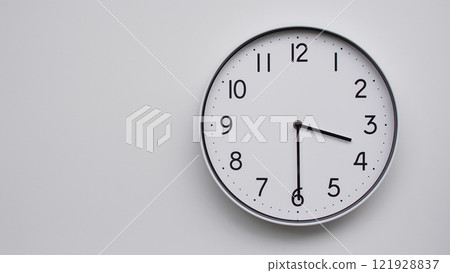 Minimalist Analog Wall Clock with White Face and Simple Black Hands Showing 15.30/03.30 - Ideal for Time Management and Modern Decor Concepts Minimalist Analog Wall Clock with White Face and Simple Black Hands Showing 15.30/03.30 - Ideal for Time Management and Modern Decor Concepts 121928837