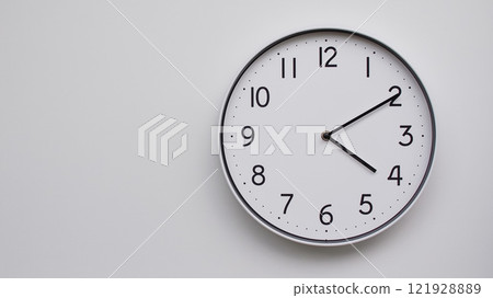 Minimalist Analog Wall Clock with White Face and Simple Black Hands Showing 16.10/04.10 - Ideal for Time Management and Modern Decor Concepts Minimalist Analog Wall Clock with White Face and Simple Black Hands Showing 16.10/04.10 - Ideal for Time Management and Modern Decor Concepts 121928889