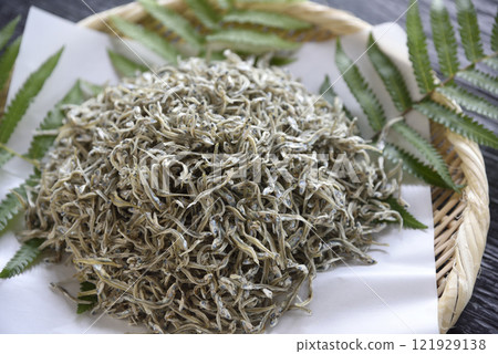 Dried small sardines served in a basket Dried small sardines served in a basket 121929138