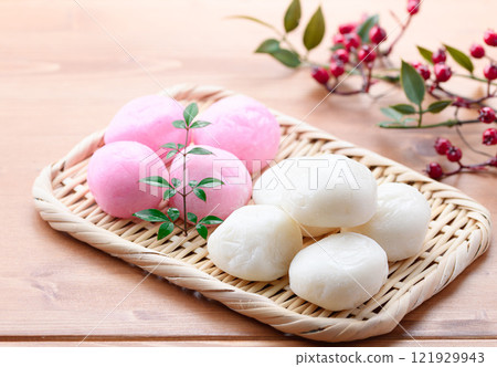 Red and white round rice cakes on a basket Red and white round rice cakes on a basket 121929943