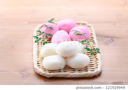 Red and white round rice cakes on a basket Red and white round rice cakes on a basket 121929949