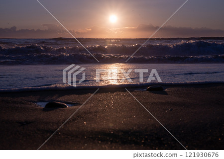 Winter sunrise seen from the sea Winter sunrise seen from the sea 121930676