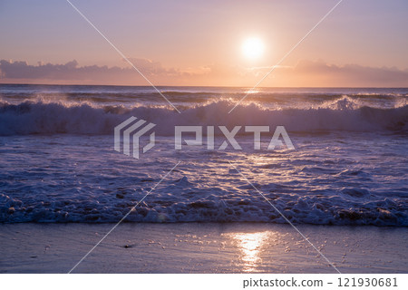 Winter sunrise seen from the sea 121930681