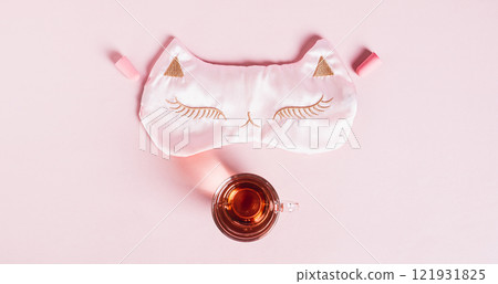 Concept insomnia sleep mask, earplugs and cherry juice with magnesium on pink web banner 121931825