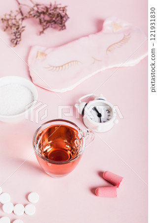 Cherry juice with magnesium powder against insomnia, earplugs and alarm clock vertical view Cherry juice with magnesium powder against insomnia, earplugs and alarm clock vertical view 121931830