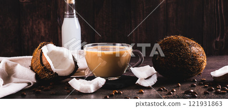 Vietnamese coconut coffee in a cup and coconut pieces on the table web banner Vietnamese coconut coffee in a cup and coconut pieces on the table web banner 121931863