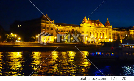 Night cruise ship passing in front of Budapest University of Technology and Economics 121932061