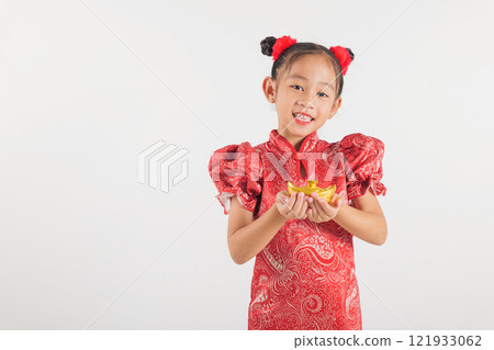 Happy Chinese New Year Smiling Asian girl wearing a red cheongsam dress holds a gold ingot, symbolizing wealth and prosperity. Isolated on a white background, festive and traditional Happy Chinese New Year Smiling Asian girl wearing a red cheongsam dress holds a gold ingot, symbolizing wealth and prosperity. Isolated on a white background, festive and traditional 121933062