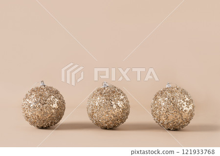 Christmas golden baubles on beige. Xmas card. Christmas golden baubles on beige. Xmas card. 121933768