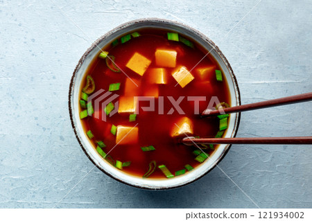 Tofu soup, Japanese cuisine. Miso soup with bean curd and green onions Tofu soup, Japanese cuisine. Miso soup with bean curd and green onions 121934002