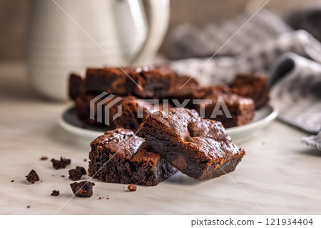 Homemade chocolate brownies on kitchen table. Homemade chocolate brownies on kitchen table. 121934404