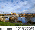 Salamanca. View of Salamanca and the Enrique Estevan bridge from the dock viewing point over the Tormes River. Traditional stone buildings. Salamanca Cathedral. SALAMANCA, SPAIN. 13 JANUARY 2025. 121935565