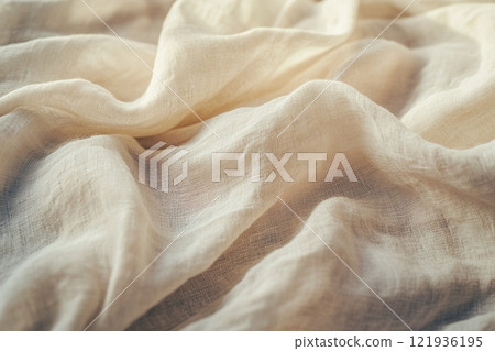 Close-up of soft organic linen fabric in a neutral beige tone with natural texture for eco-friendly themes and minimal design elements 121936195