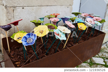 Ceramics for sale on the street market in Nazare. Authentic traditional portuguese souvenirs 121936526