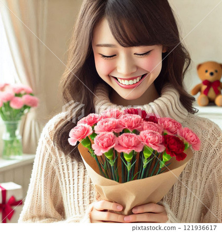 A girl holds a bouquet of pink and red carnations, January birth flowers A girl holds a bouquet of pink and red carnations, January birth flowers 121936617