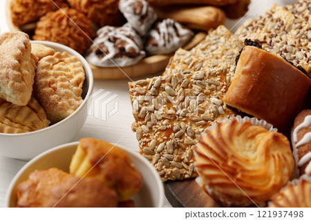 Delicious assortment of bakery treats displayed on a table at a festive gathering 121937498