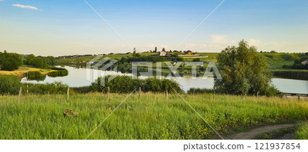 Rural landscape, nature photo, fields with wheat, background of ripening ears at sunrise, cloudy, sky background, horizon, rural meadows, country road, also, river, birch grove, Ukraine, Kharkov, prin Rural landscape, nature photo, fields with wheat, background of ripening ears at sunrise, cloudy, sky background, horizon, rural meadows, country road, also, river, birch grove, Ukraine, Kharkov, prin 121937854