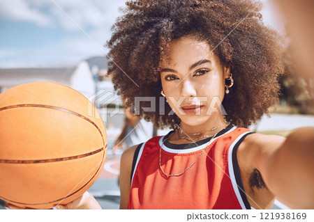 Cool selfie of basketball player with funky, confident and hipster attitude ready for game, fun or playing outdoor sport match. Portrait of young, beautiful and black woman with afro hair on court 121938169