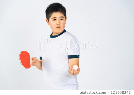 Boy holding a table tennis racket 121938242