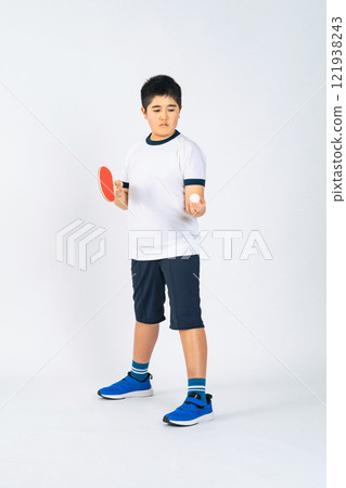 Full body photo of a boy holding a table tennis racket 121938243
