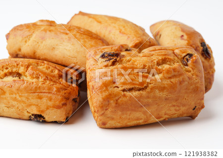 Freshly baked sweet rolls with a golden crust and soft texture ready to be enjoyed in a cozy kitchen setting 121938382