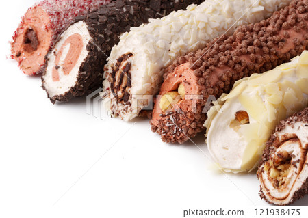 Delicious dessert rolls filled with cream and coated in chocolate and nuts, ideal for any celebration or gathering 121938475