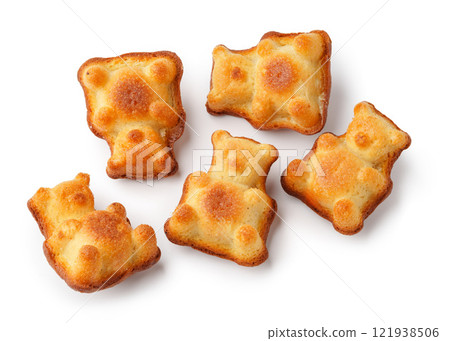 Sweet bear-shaped treats on a white background, perfect for parties and snacks, made with fluffy cake batter and a golden crust Sweet bear-shaped treats on a white background, perfect for parties and snacks, made with fluffy cake batter and a golden crust 121938506