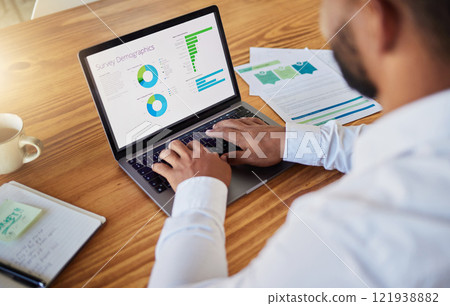 Business man planning with finance graph on laptop at work, working on stats and data and doing marketing research in office. Professional worker typing on computer and reading information online Business man planning with finance graph on laptop at work, working on stats and data and doing marketing research in office. Professional worker typing on computer and reading information online 121938882