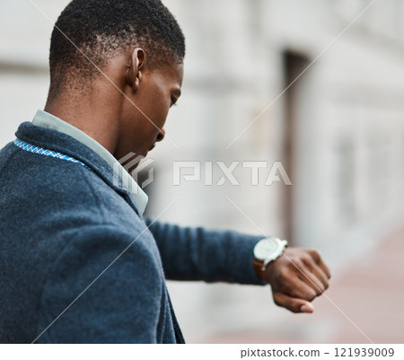 Running late, checking time on watch and feeling stressed, anxious and in hurry to get to work. Rushing entrepreneur in city, town or downtown missing a morning office appointment or public transport 121939009
