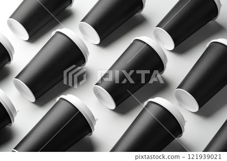 Multiple black takeaway coffee cups arranged in a repeating pattern on a white surface Multiple black takeaway coffee cups arranged in a repeating pattern on a white surface 121939021