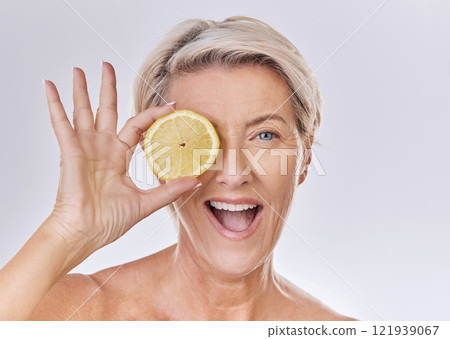 Skincare, wellness and face of mature woman with wrinkles holding lemon with nutrition, vitamins and health. Portrait of happy senior lady with fruit and healthy, organic and fresh self care routine. Skincare, wellness and face of mature woman with wrinkles holding lemon with nutrition, vitamins and health. Portrait of happy senior lady with fruit and healthy, organic and fresh self care routine. 121939067