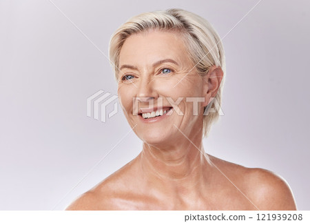 Mature beauty and skin of woman posing in skincare and cosmetics with teeth and smile. Portrait of a happy senior model or elderly lady face in wellness with healthy skin care in a studio. 121939208