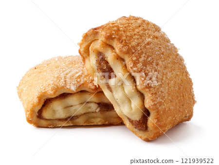 Crispy pastry filled with sweet apple filling, freshly baked and coated with sugar Crispy pastry filled with sweet apple filling, freshly baked and coated with sugar 121939522