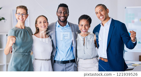 Multicultural, smiling and celebrating success, a startup group in a modern office. Attractive, diverse, young and happy team in the workplace, ready to work and support future financial projects. 121939526