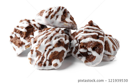 Delicious chocolate cookies with white icing drizzled, making a tempting dessert display perfect for any occasion 121939530