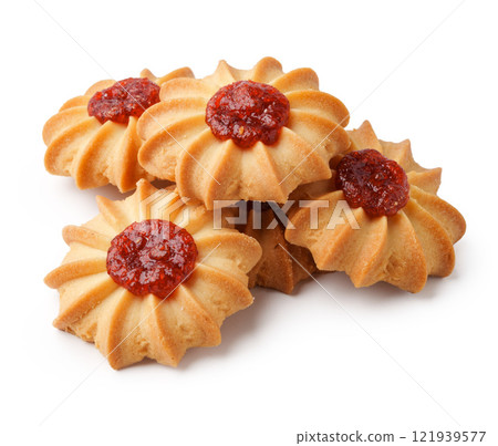 Delicious jam-filled cookies arranged attractively on a white background, showcasing their delightful texture and color Delicious jam-filled cookies arranged attractively on a white background, showcasing their delightful texture and color 121939577
