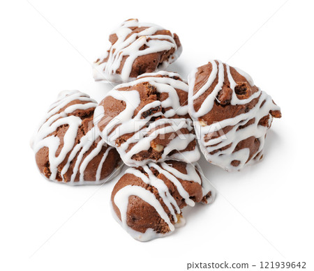 Delicious chocolate cookies with white icing arranged on a clean background for a tempting dessert display Delicious chocolate cookies with white icing arranged on a clean background for a tempting dessert display 121939642