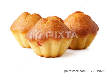 Muffins baked to golden perfection displayed on a clean surface for a delightful treat 121939695