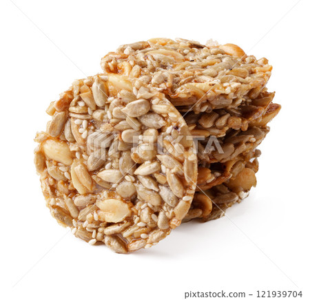 Delicious round seed snacks stacked together showcasing a healthy treat option for any time of day Delicious round seed snacks stacked together showcasing a healthy treat option for any time of day 121939704