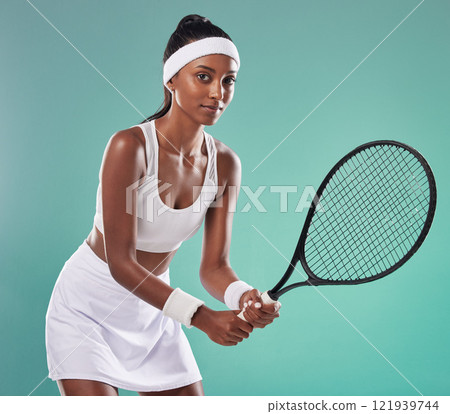 Sports woman, tennis and portrait of athlete playing a game in the court. Active, fit and motivated person wearing professional sportswear. Female tournament or championship for winning competitors. Sports woman, tennis and portrait of athlete playing a game in the court. Active, fit and motivated person wearing professional sportswear. Female tournament or championship for winning competitors. 121939744