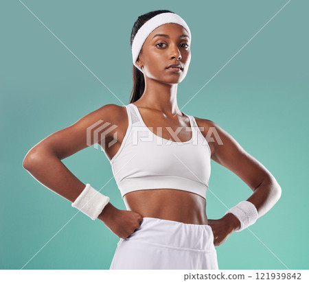 Wellness, fitness and power by a confident athletic woman serious about her health and body goals. Portrait of a gym trainer or coach with an assertive, tough, attitude and healthy lifestyle 121939842